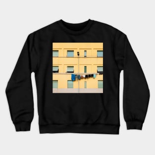 Laundry Drying on Washing Line Against Yellow Building Facade in Italy Crewneck Sweatshirt